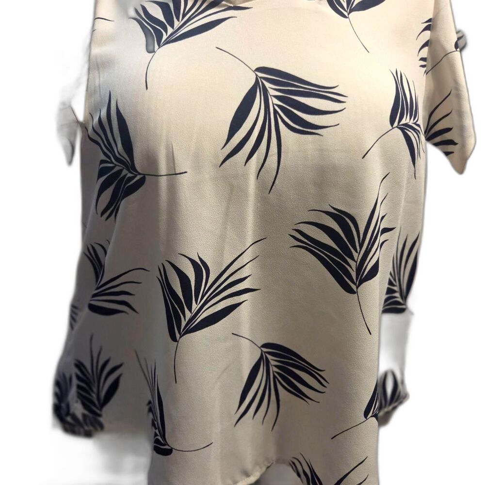 short-sleeve V-neck blouse with a dark blue palm leaf print
